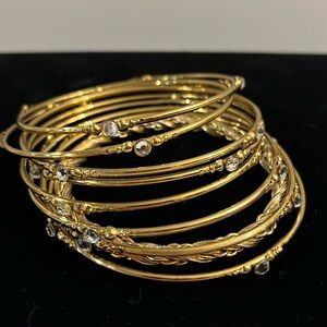 9 Bangle Bracelets. Gold tone. New & in excellent condition, 8 has 4 Rhinestones